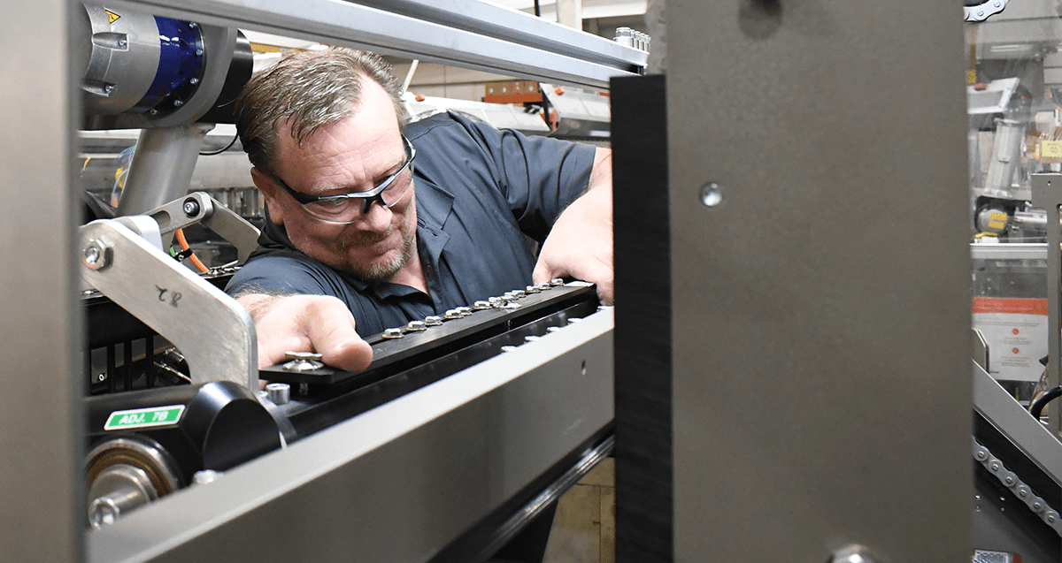 Mechanic adjusting parts inside machine