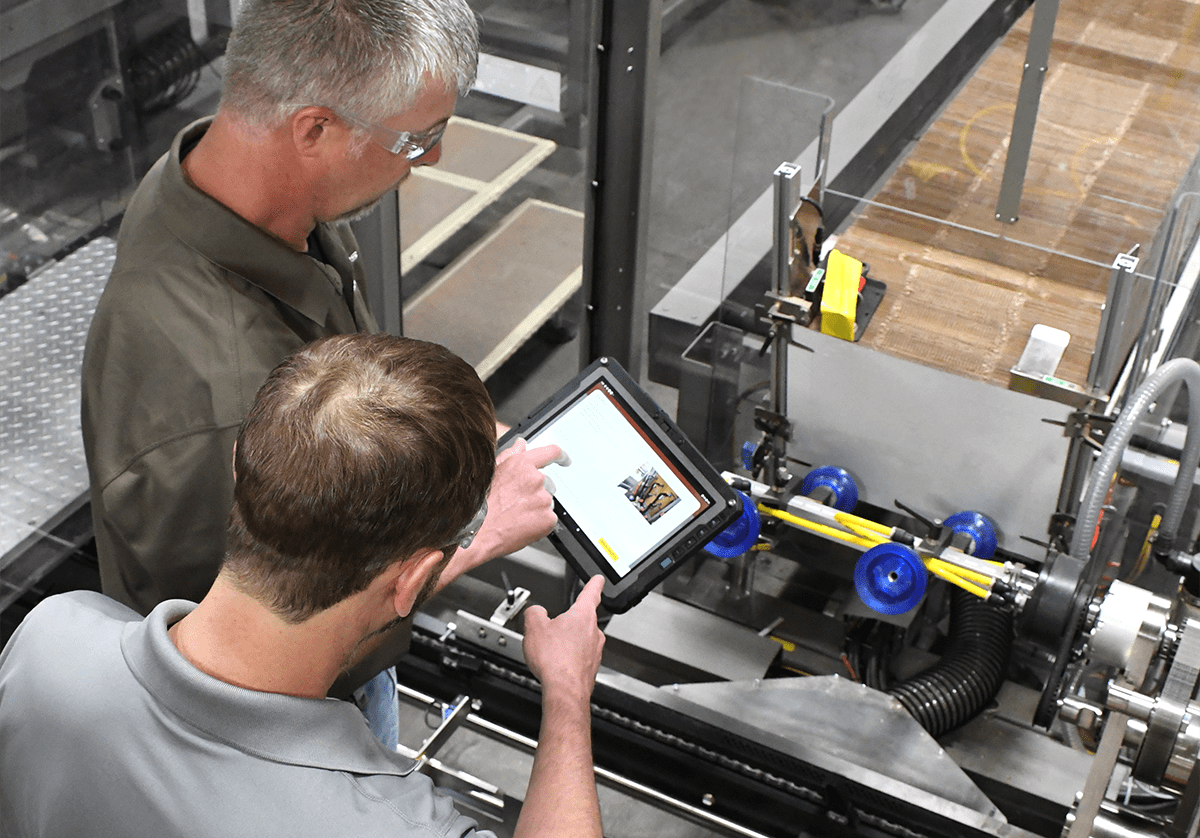 Technicians working on machine