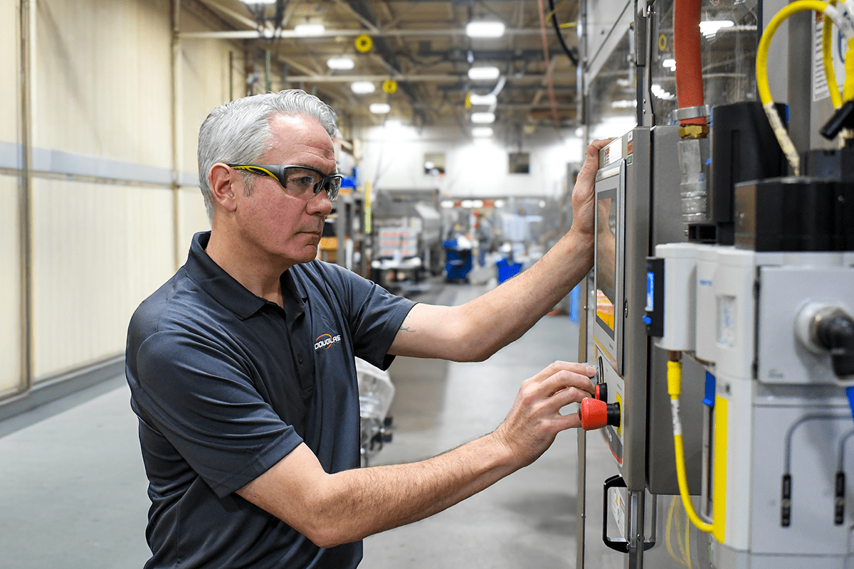 Man working on HMI at machine