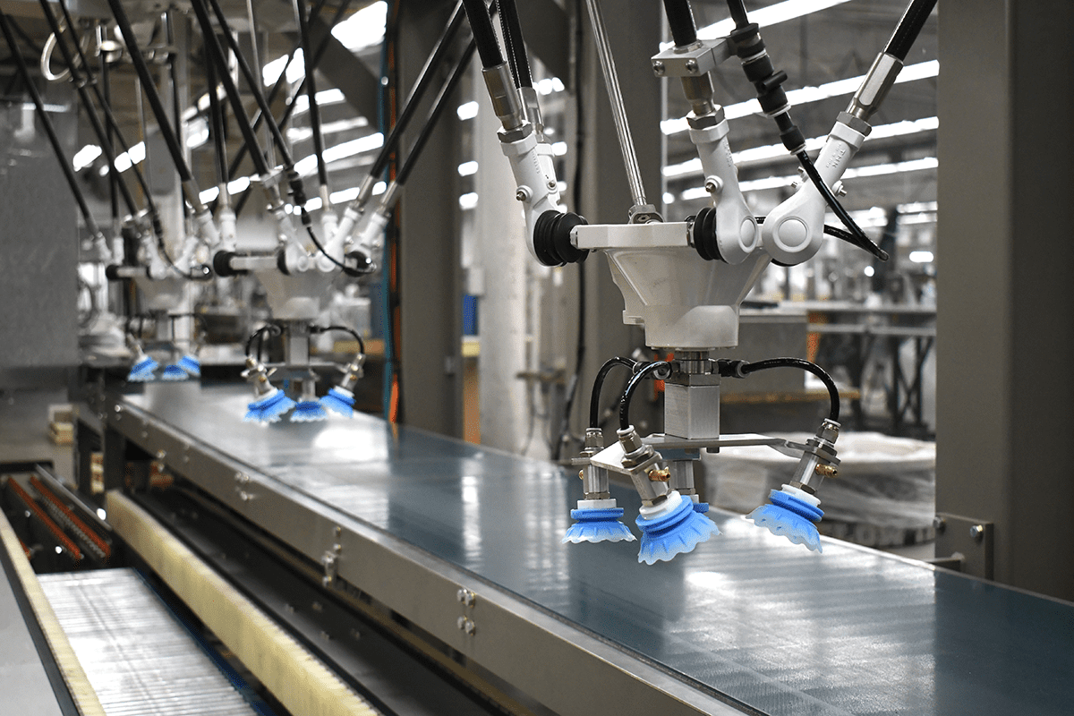Robotic arms on a secondary packaging machine