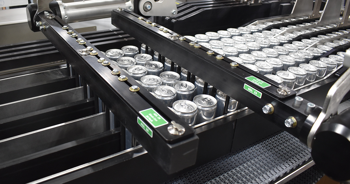 Cans on a conveyor separated into lanes
