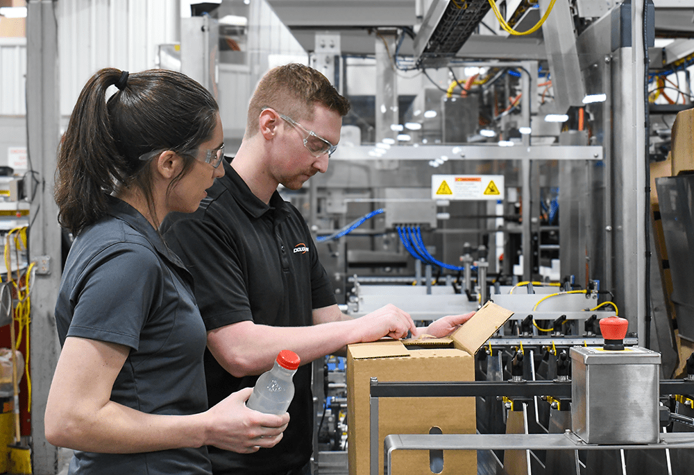 Tech working on packaging machine