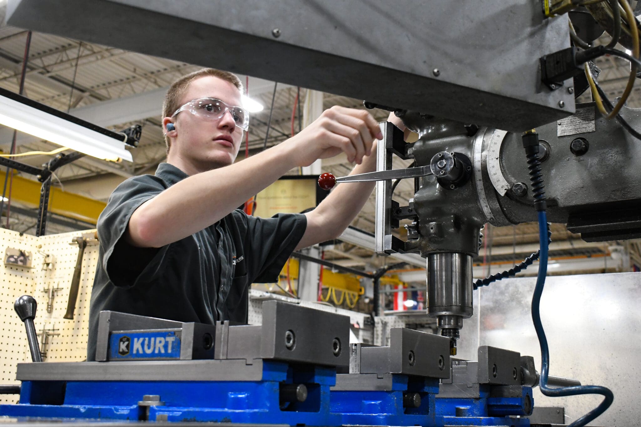 Tech working on packaging machine