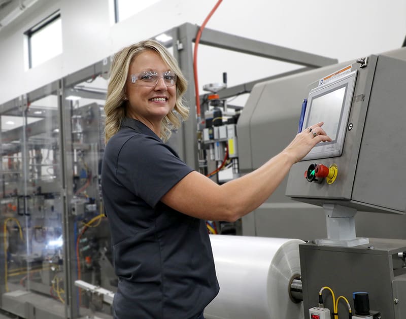 Tech working on packaging machine