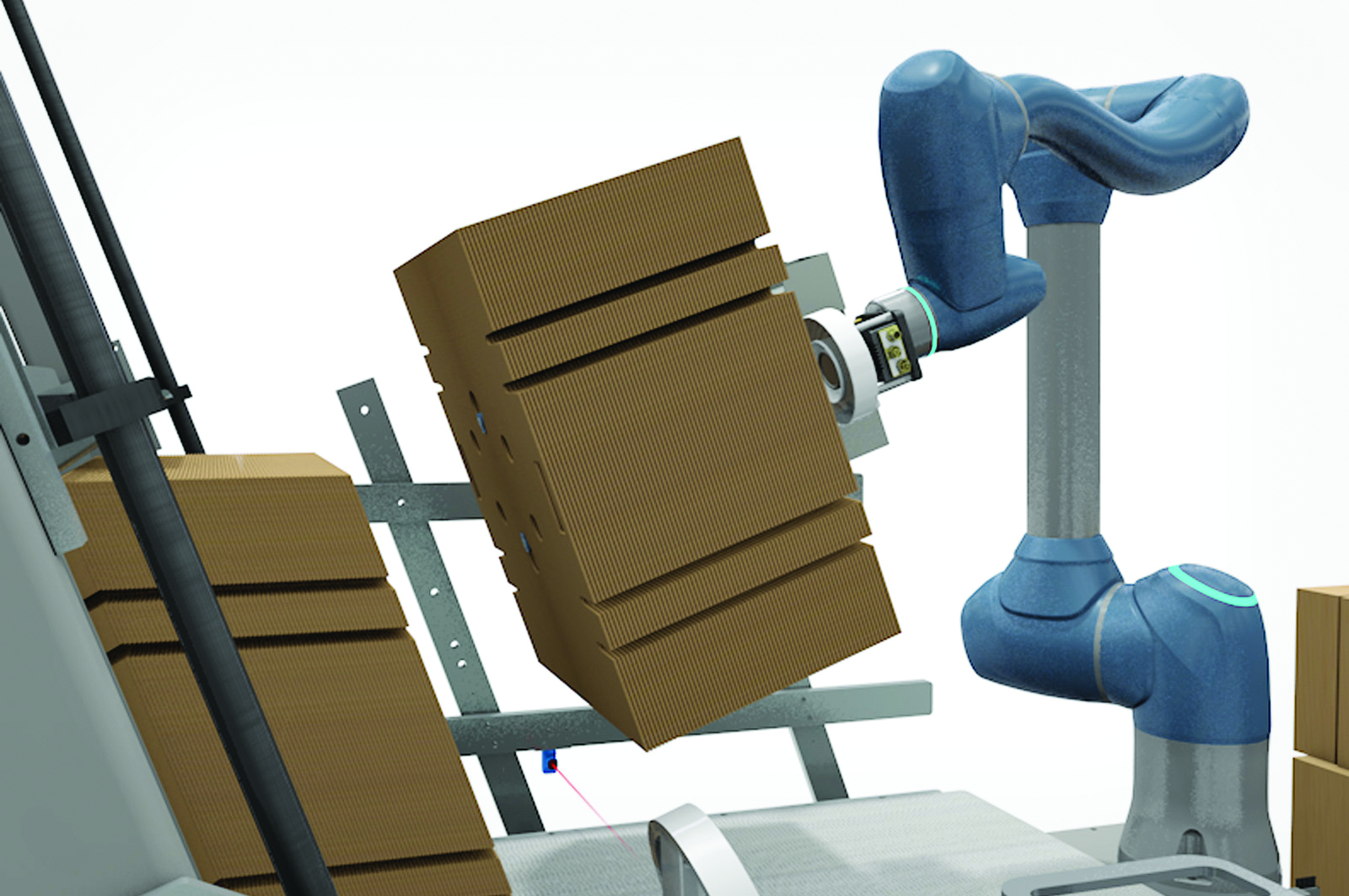 LoadX robotic arm holding a stack of collapsed cases and moving them to magazine