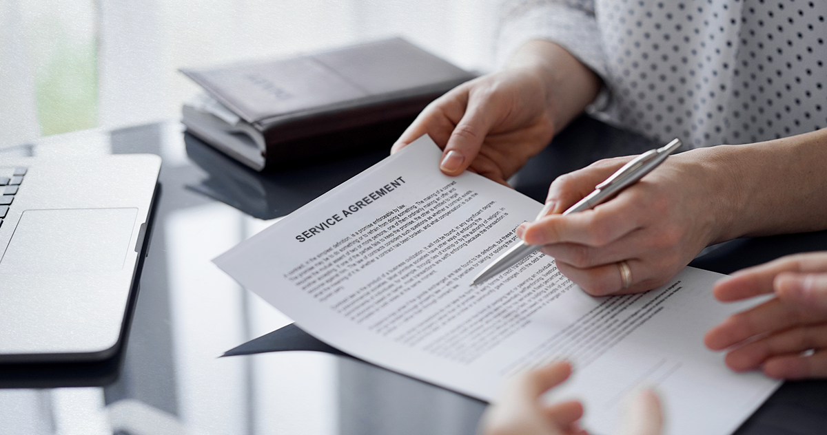 A business person going over a service agreement document