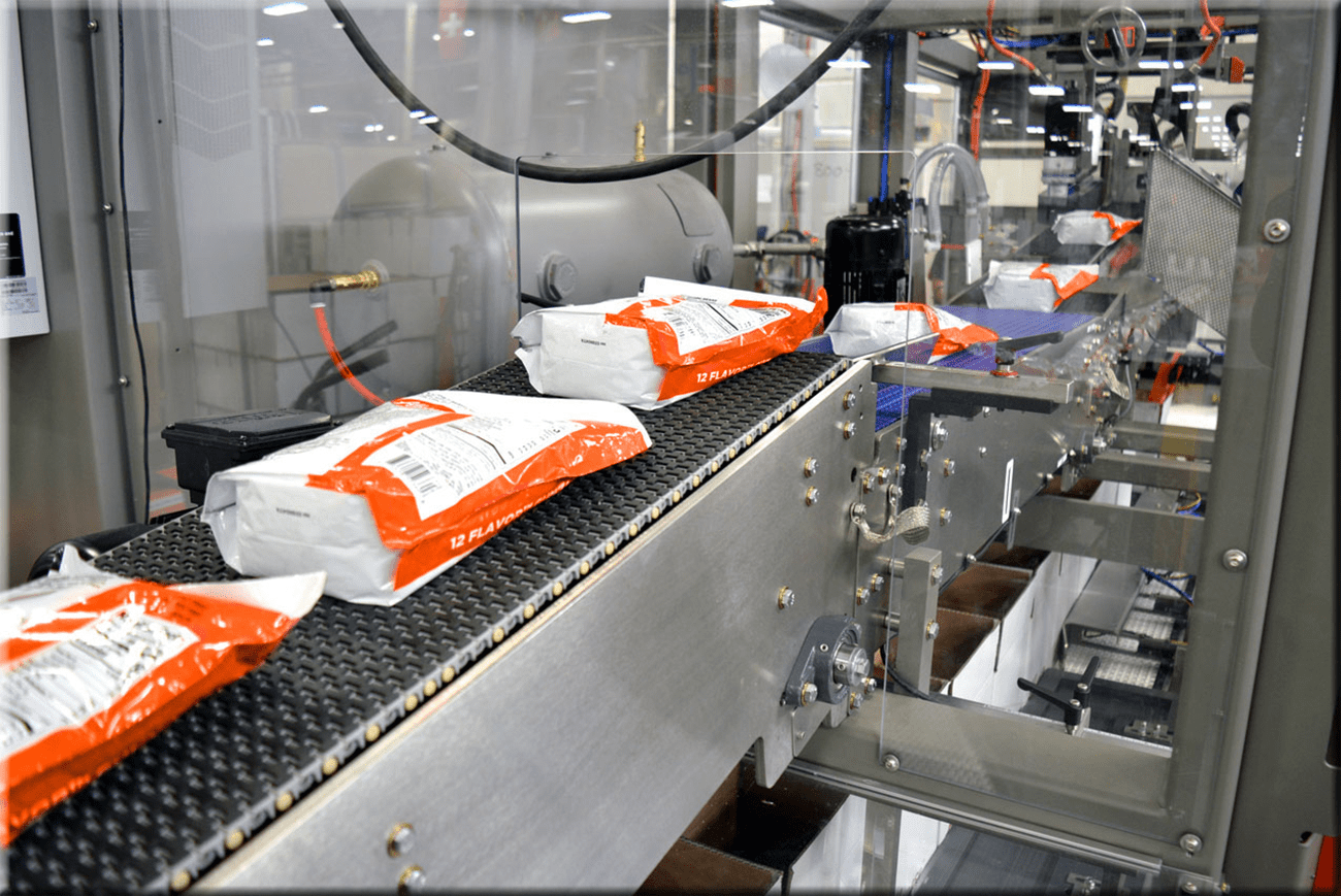 Pouches on conveyor